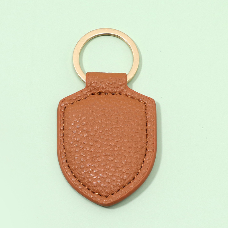 Shield leather car keychain business creative leather keychain personalized small gift keyring pendant wholesale